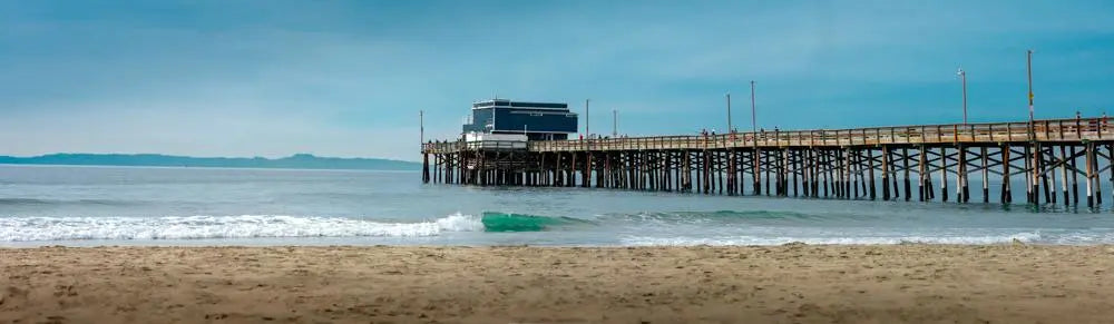 Timeless Beauty: Panoramic Vista of Newport Beach's Pier and Waves Giclee / Colored / 24x6 Tracy McCrackin Photography Wall art - Tracy McCrackin Photography