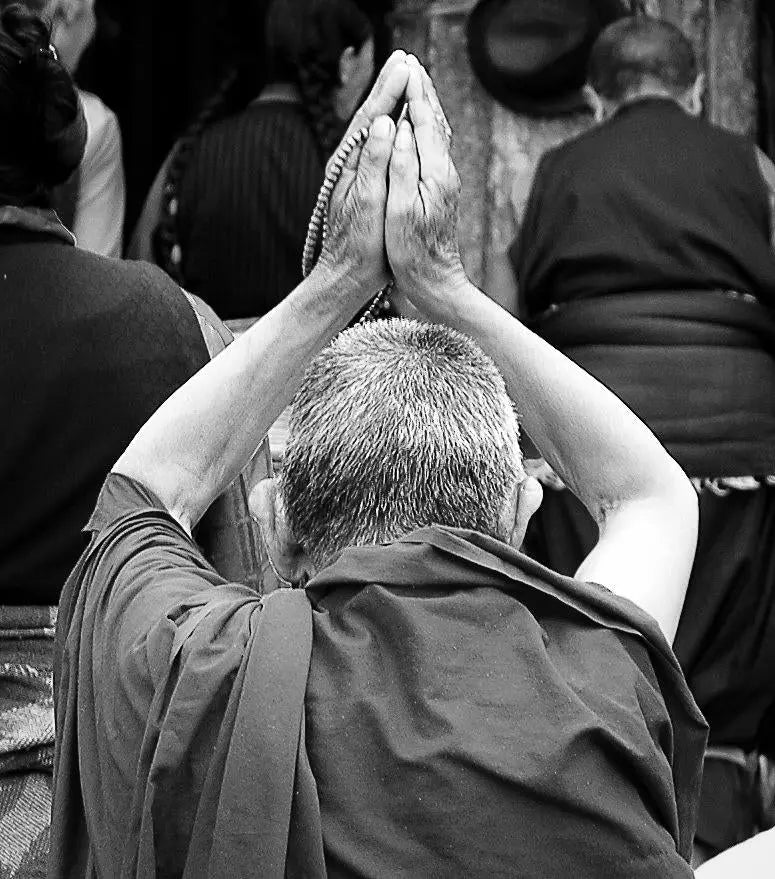 Divine Reverence: A Praying Monk in Tibet Tracy McCrackin Photography wall art - Tracy McCrackin Photography