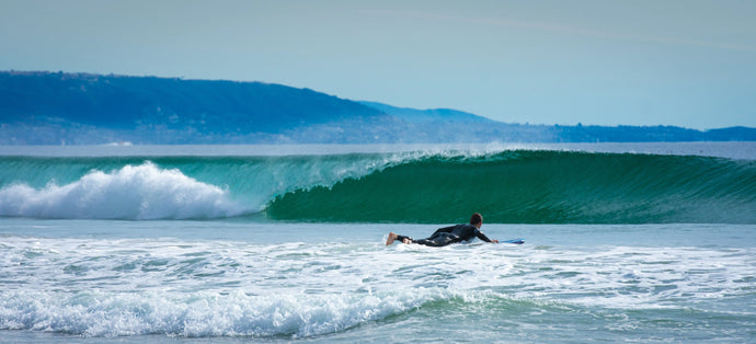 Into the Abyss Panorama: Surfer Paddling into Newport's Grand Waves Tracy McCrackin Photography Wall art - Tracy McCrackin Photography