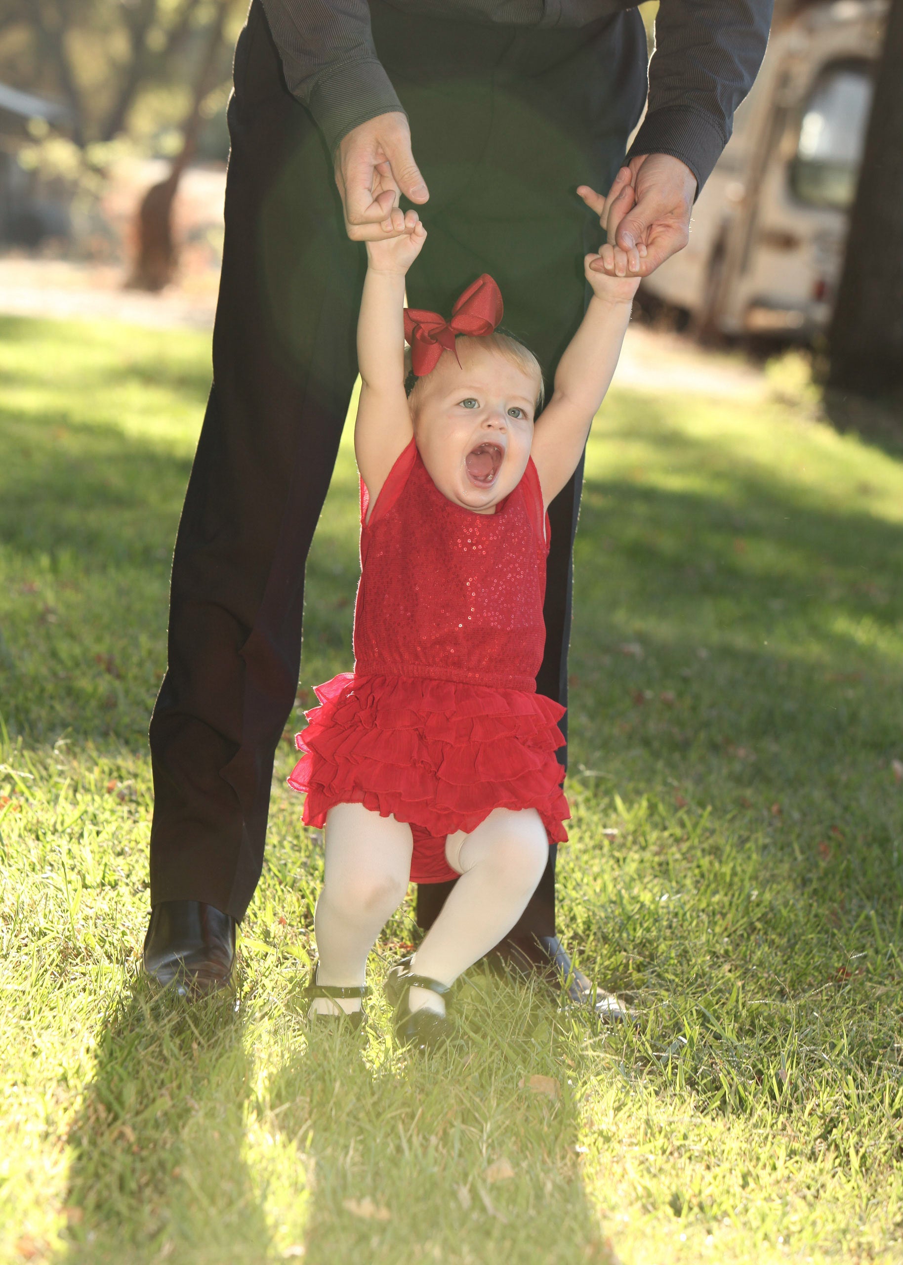 child-swinging-with-father-red-dress Giclee / Colored / 5 x 7 Tracy McCrackin Photography - Tracy McCrackin Photography